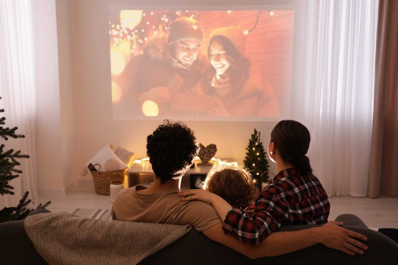 Family watching movie with a projector
