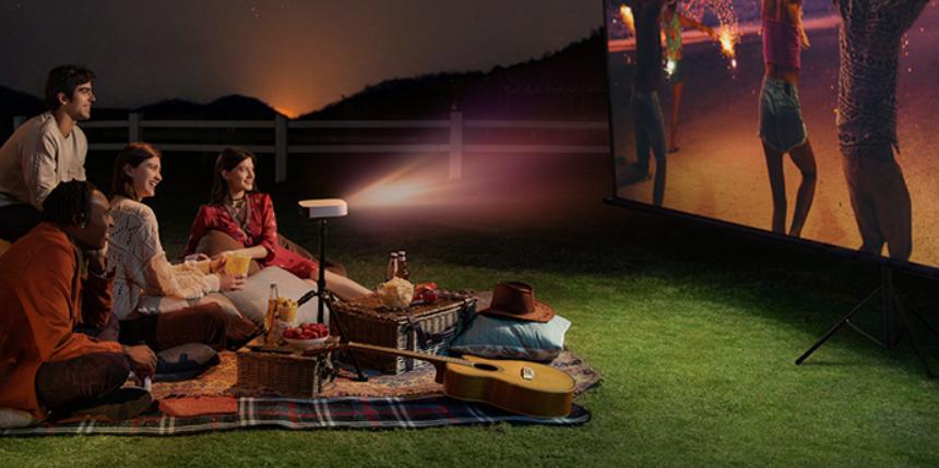 Family Watching Movies With A Projector