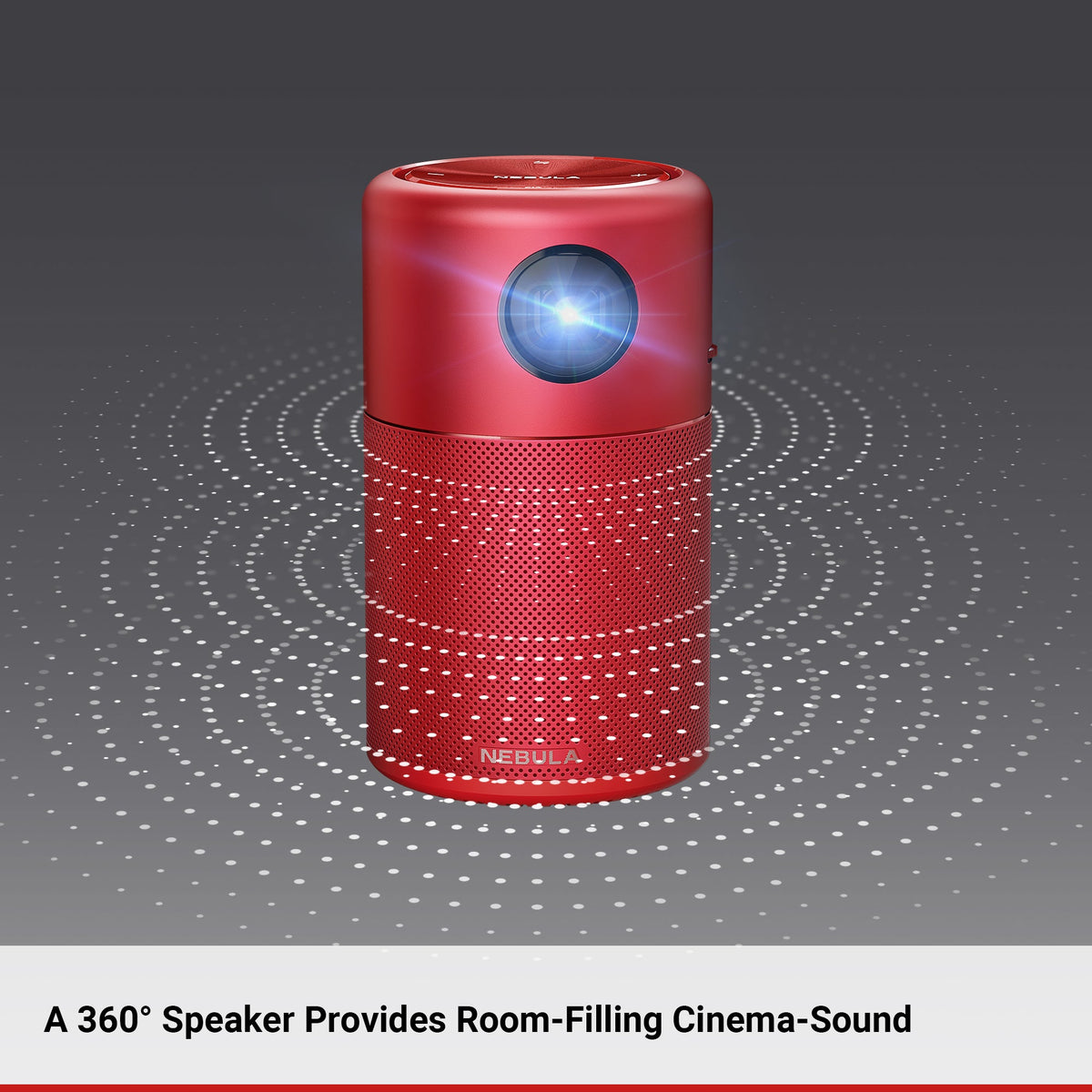 A red Nebula Capsule portable projector sits in a gray room with white, speckled swirls emanating sound.