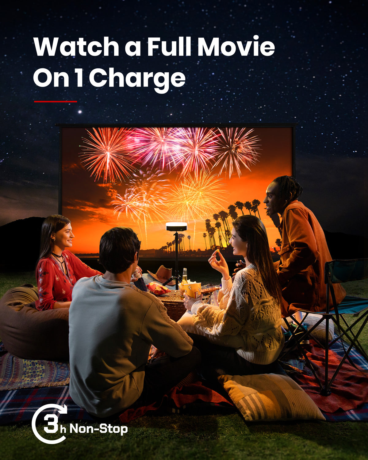A group of friends use a Solar Portable projector to watch fireworks on a screen while they sit outside at night.