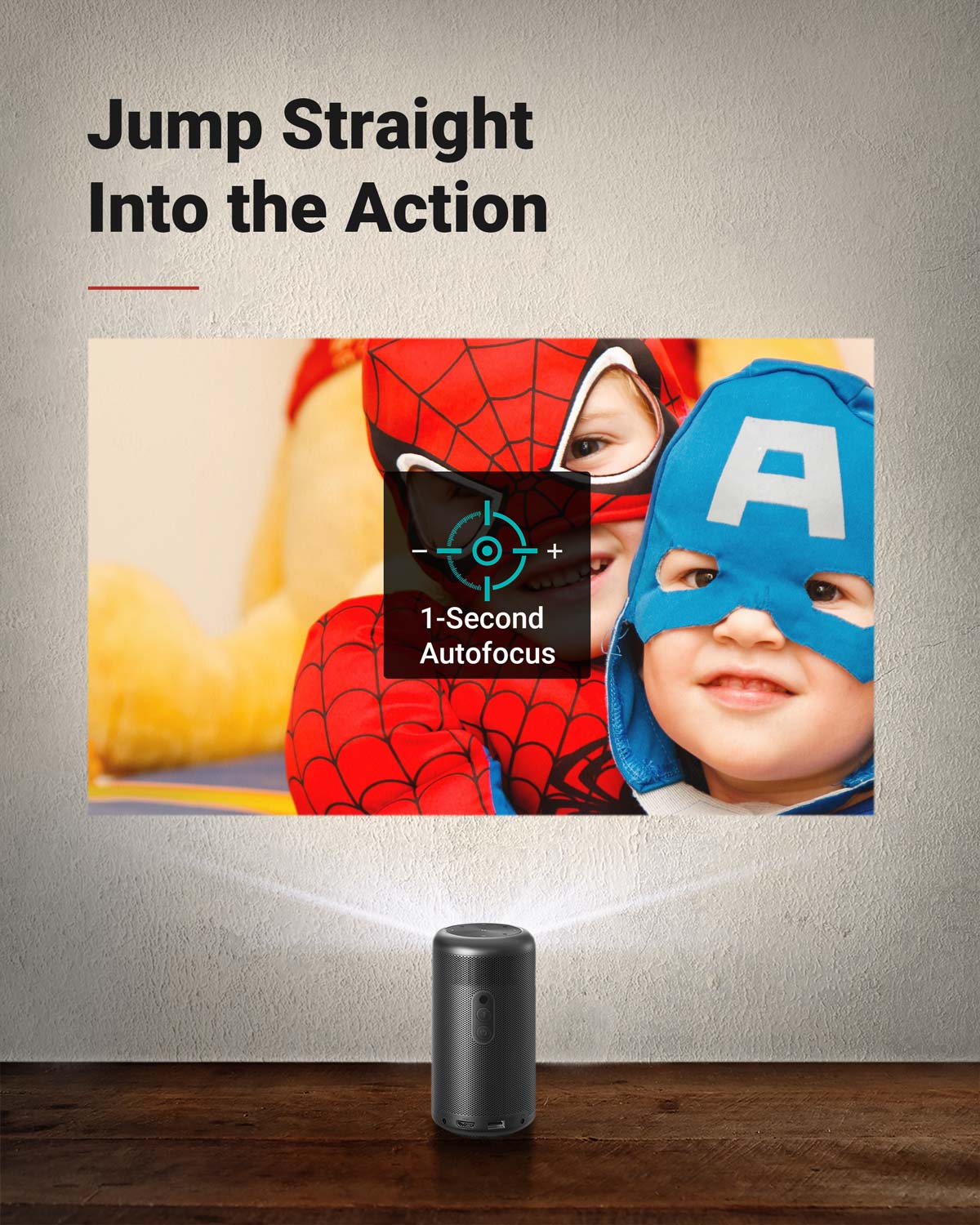 A Capsule II portable projector sits on the floor and displays two kids wearing Spiderman and Captain America costumes.
