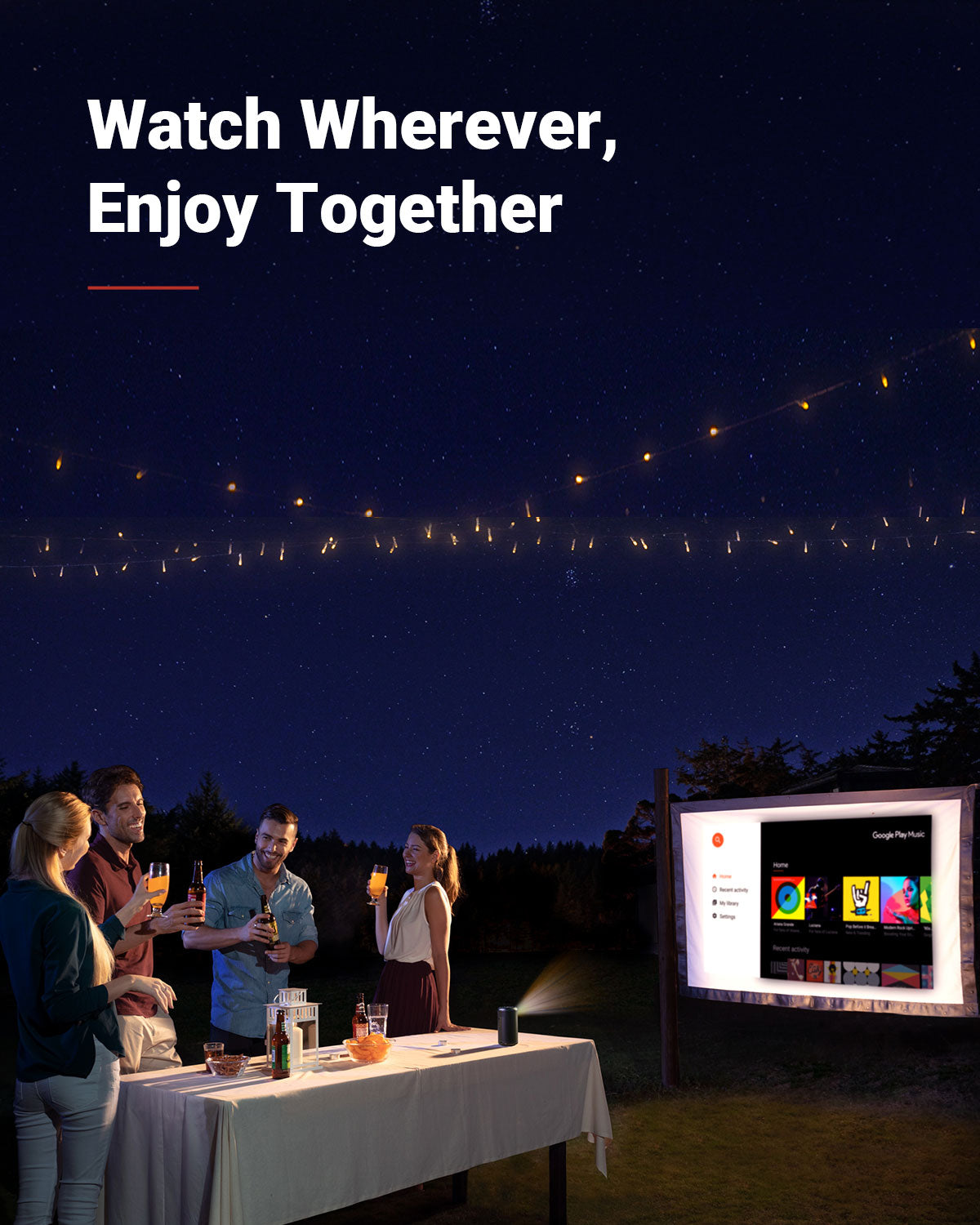 A group of friends enjoy drinks during an outdoor party while a Capsule II portable projector displays a menu on a screen.